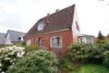Scheeßel: zentral gelegenes Einfamilienhaus mit Einliegerwohnung und großem Garten - Titelbild
