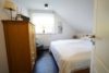 Reeßum-Schleeßel: Charmantes Einfamilienhaus auf einem 1.283 m² Grundstück - Schlafzimmer im Dachgeschoss