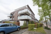Ansicht des Wohnhauses - Helle, attraktive 2-Zimmer-Eigentumswohnung im Obergeschoss mit großem Eckbalkon