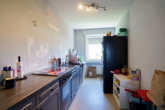 Küche (EBK gehört dem aktuellen Mieter) - Attraktive 4-Zimmer-Wohnung im 1. Obergeschoss mit Loggia und Garage
