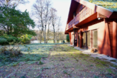 Terrasse - Wohnen am Waldrand – Holzhaus mit Wintergarten, Kamin und Naturgrundstück